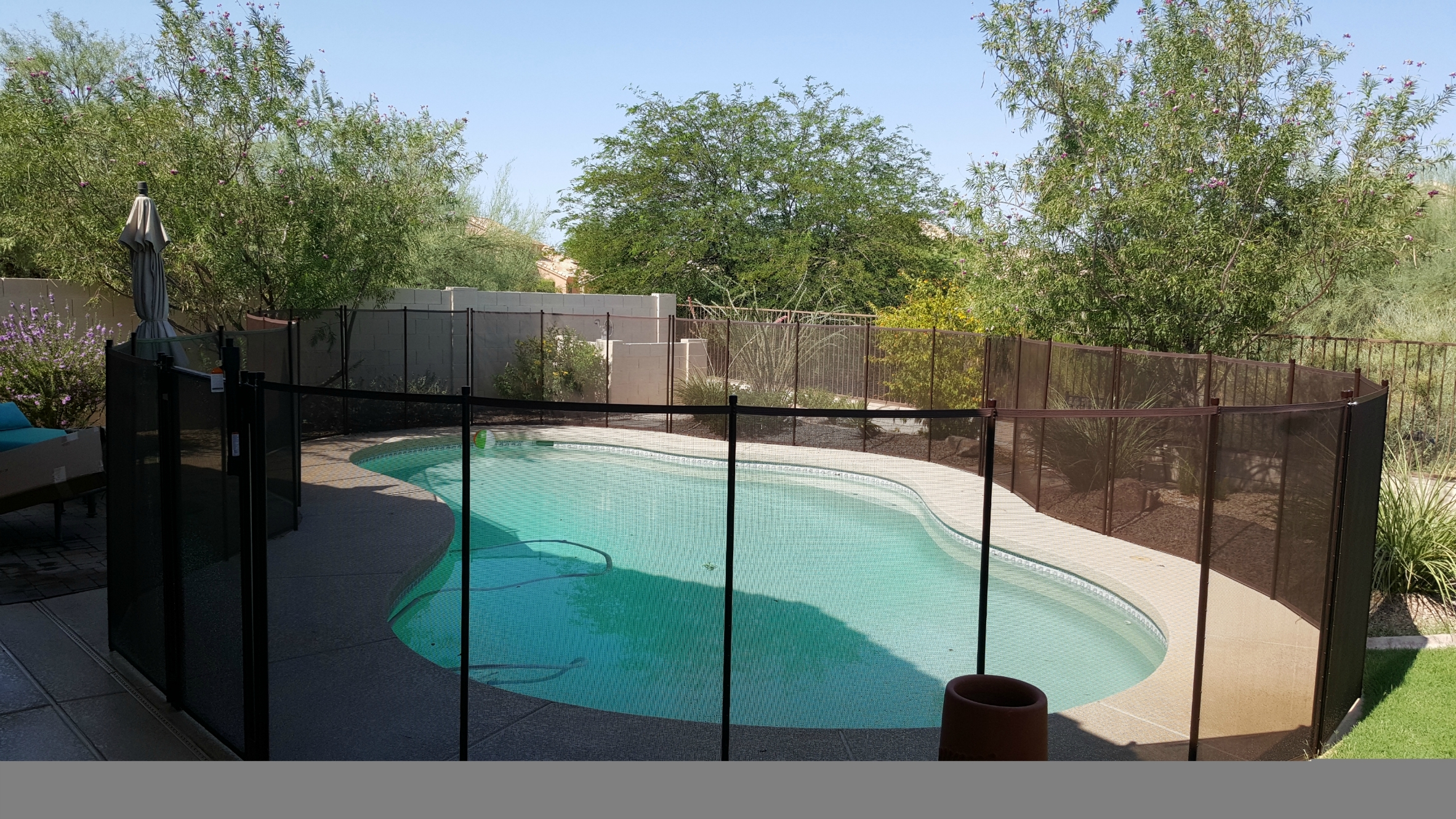 Katchakid's removable pool safety fence in antique bronze.