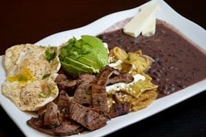 Green Chilaquiles with Grilled Steak, Eggs, & Beans