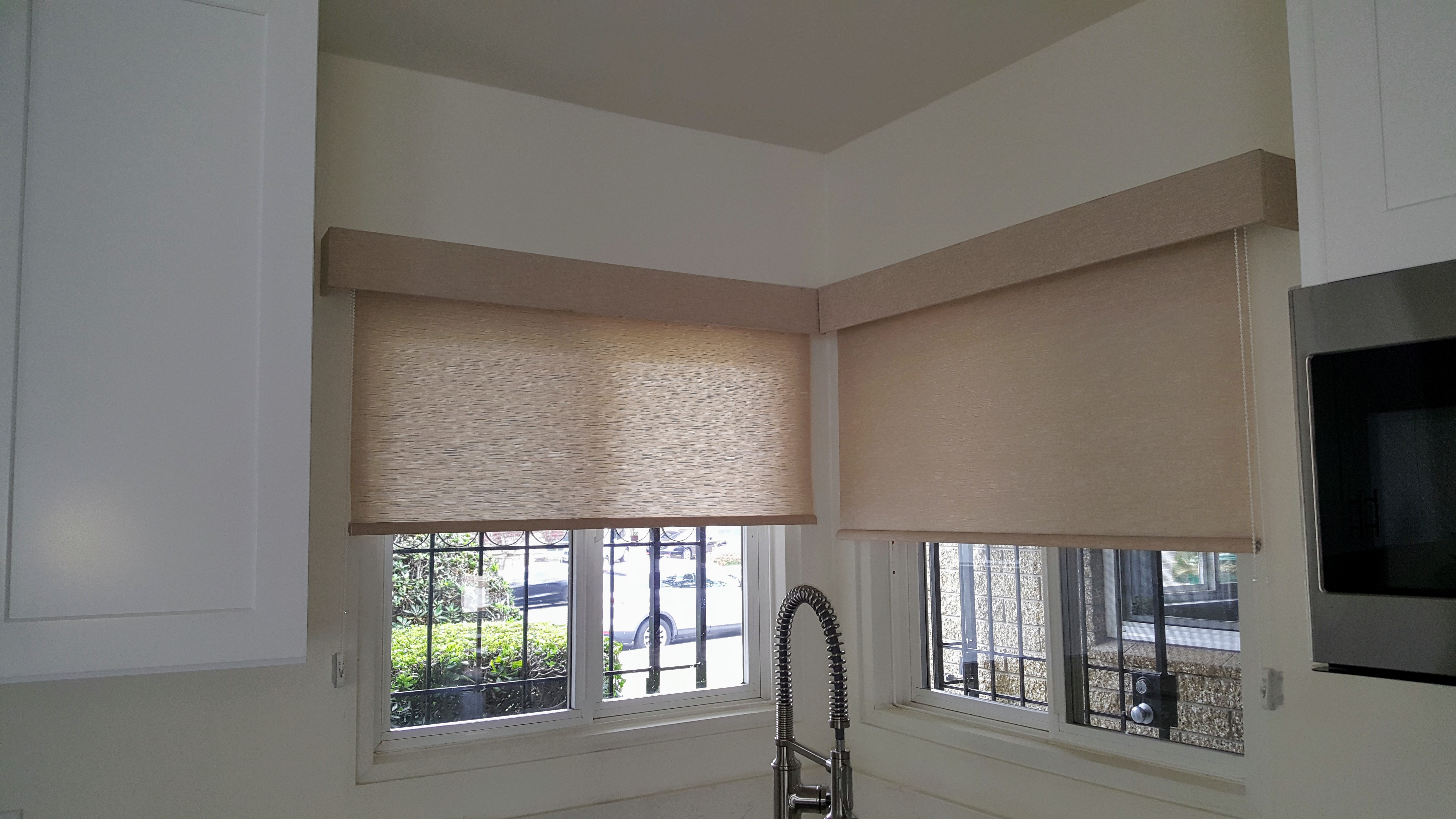 Roller Shades with coordinating cornices in a corner window in La Jolla kitchen.