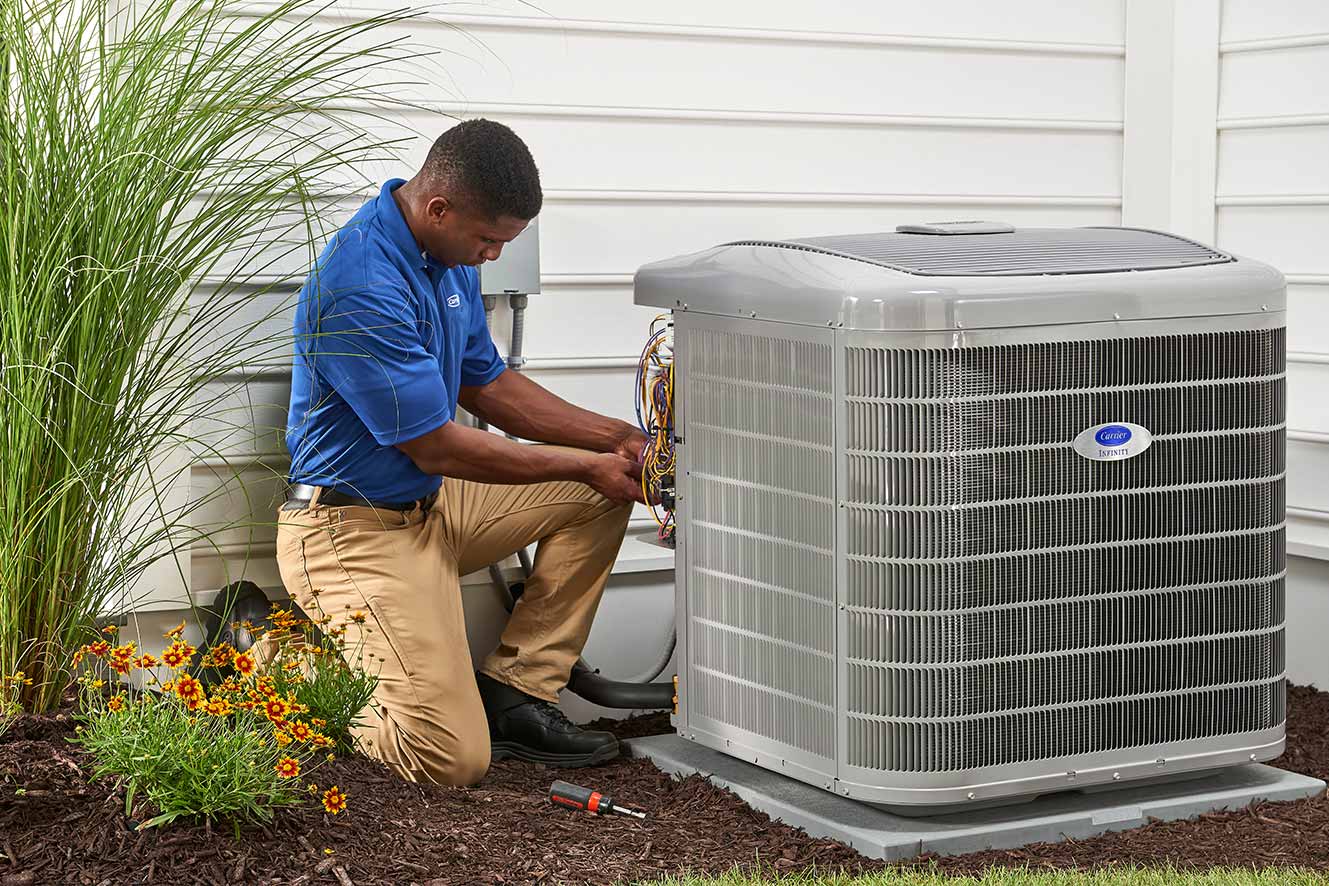 A Carrier dealer performs an HVAC installation