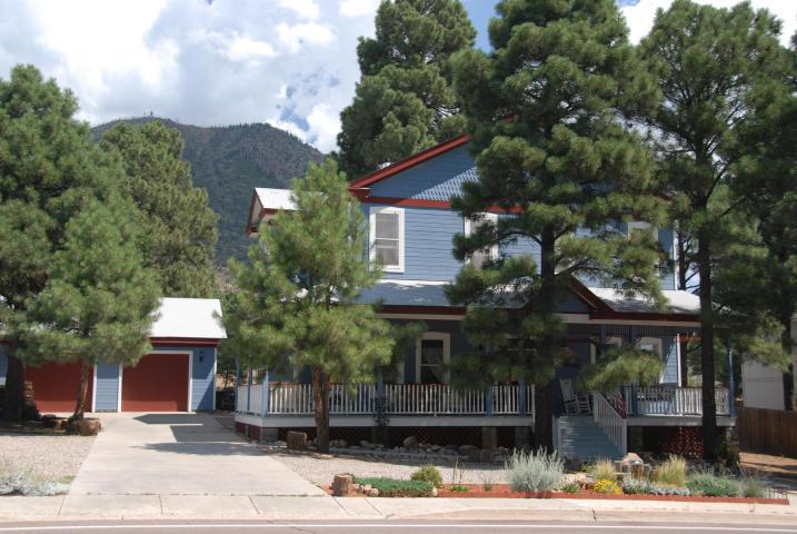 This Fabulous 1912 Victorian Replica is currently a well established and profitable Bed & Breakfast that is nestled in the gorgeous Ponderosa Pines. Price includes the turn key business. The Solid Oak Plank wood flooring through out is sure to please your guests. The warm and cozy living room offers a beautiful wood stove, vaulted ceilings and Victorian charm.