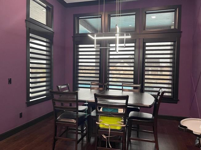 This is dining room goals! The addition of our Dual Shades really helps the dark elements of this Owasso dining room stand out against those gorgeous deep purple walls!  BudgetBlindsOwasso  OwassoOK  DualShades  FreeConsultation  WindowWednesday