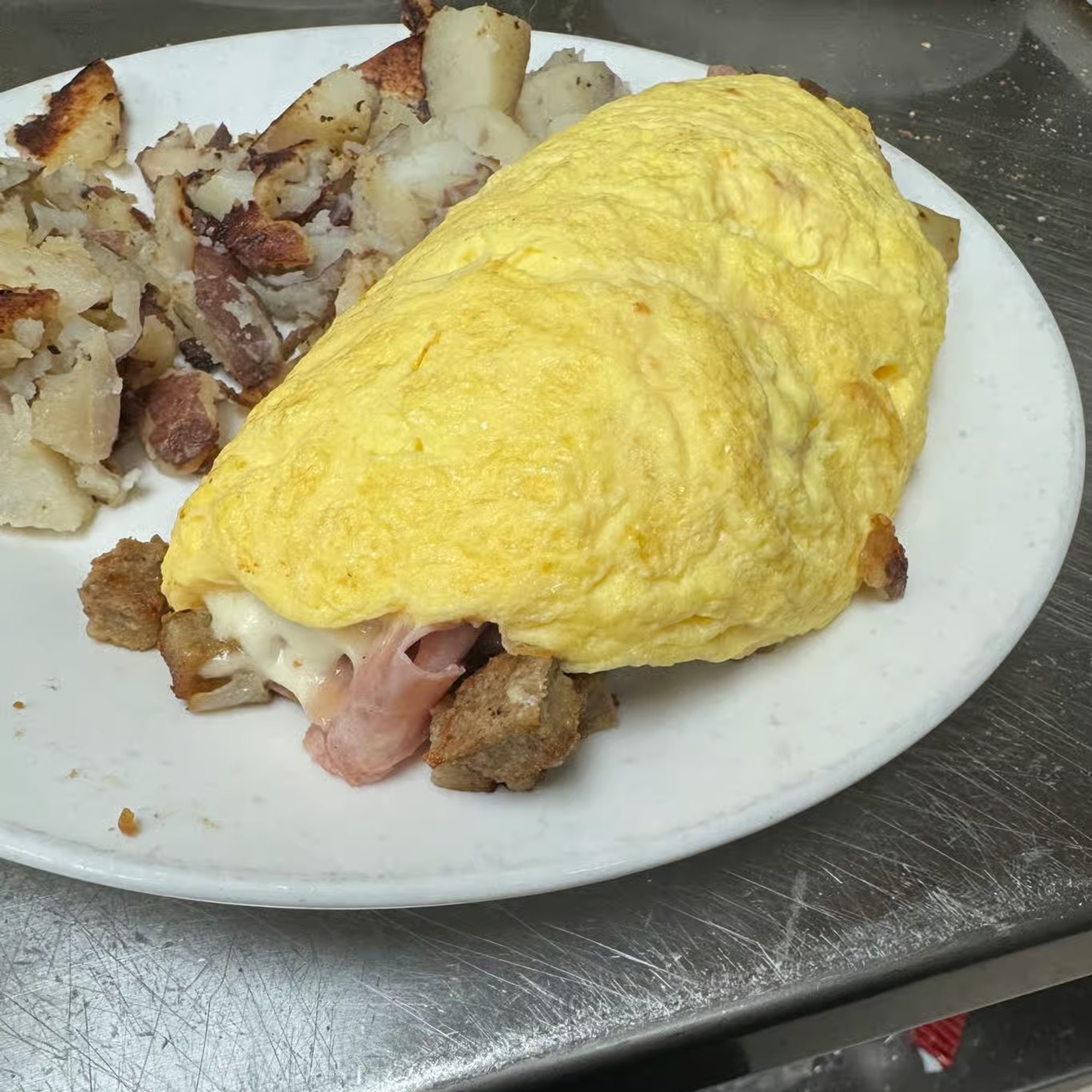 Scrapple Ham, Mushroom, Onion, Provolone Omelete