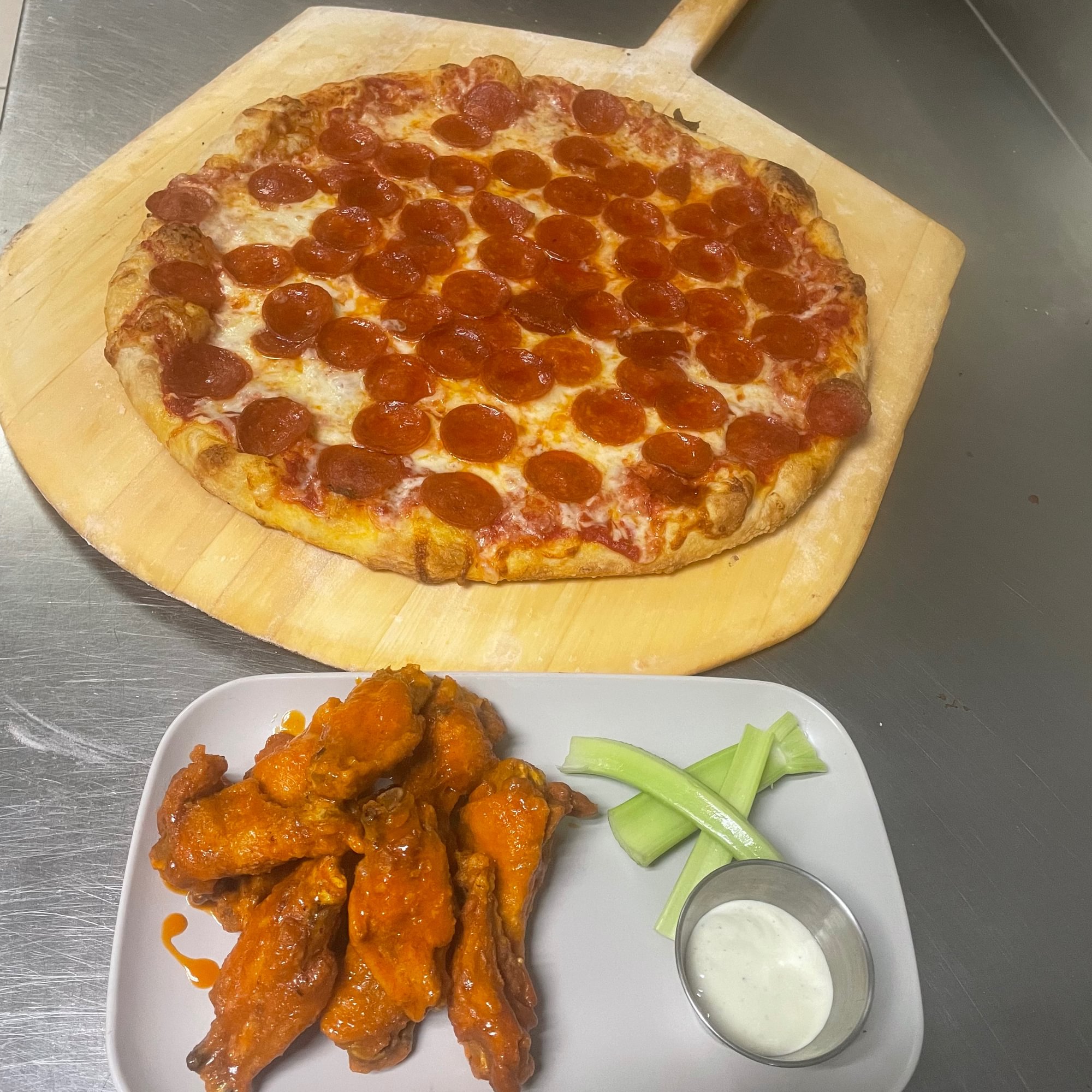 $1 Wings with Large Gourmet Pizza
