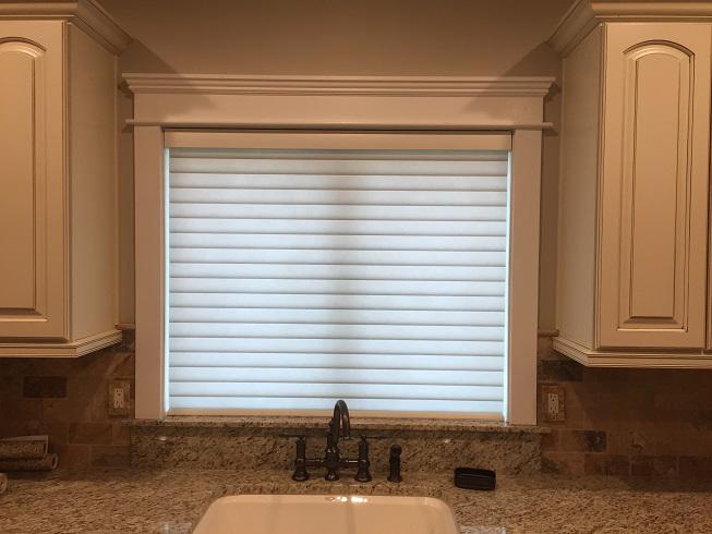 This window shade will save you money! Our Hunter Douglas Sonnette Shades, as shown in this Phillipsburg, NJ home, offer superior light diffusion with added energy efficiency. It looks like a simple roller shade, but two layers of fabric provide added insulation. Stay warm in winter and cool in summ