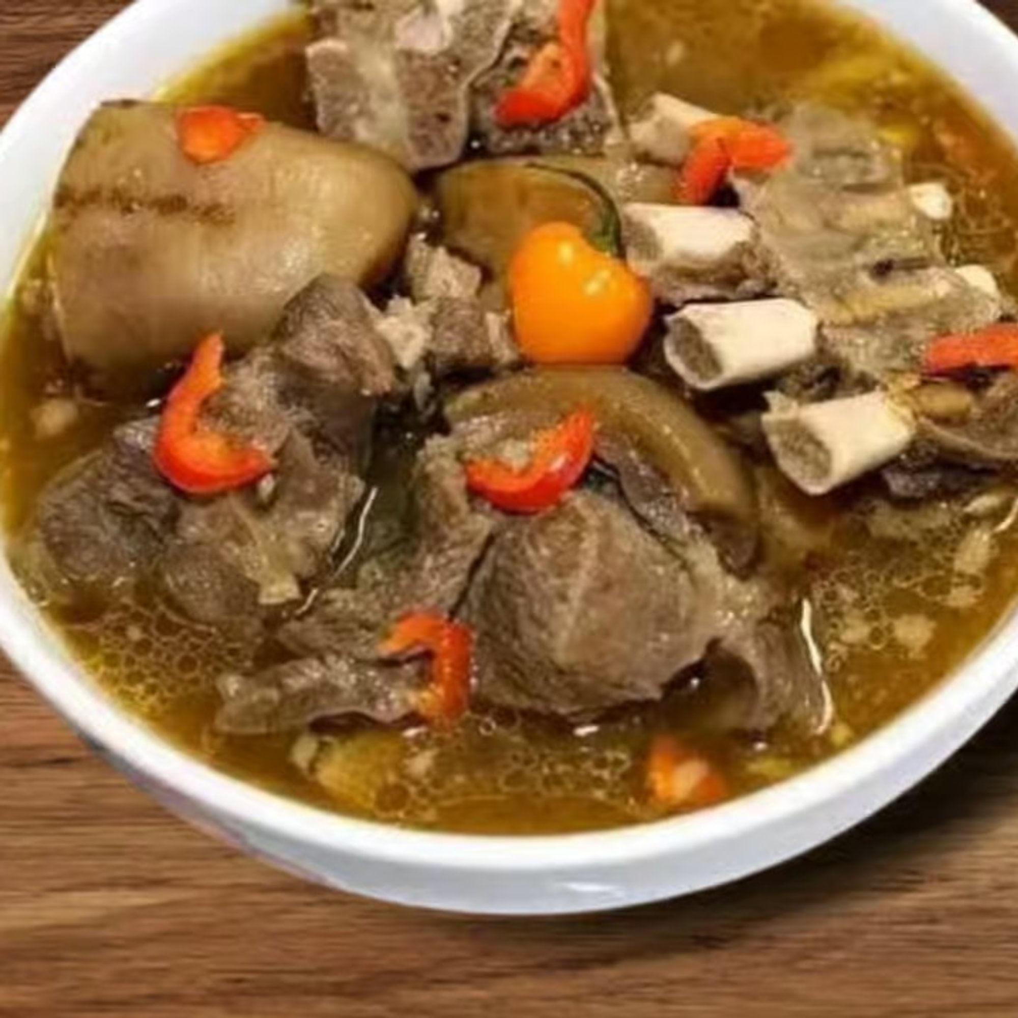 Goat Pepper Soup with White Rice, Boiled Plantains, or White Yams