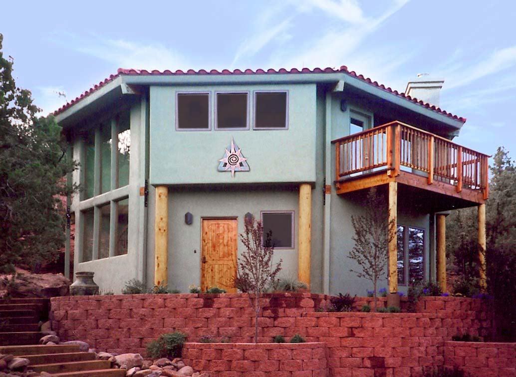 This two-story home combines a variety of design elements, creating a unique home that blends in well with its rugged southwestern setting.