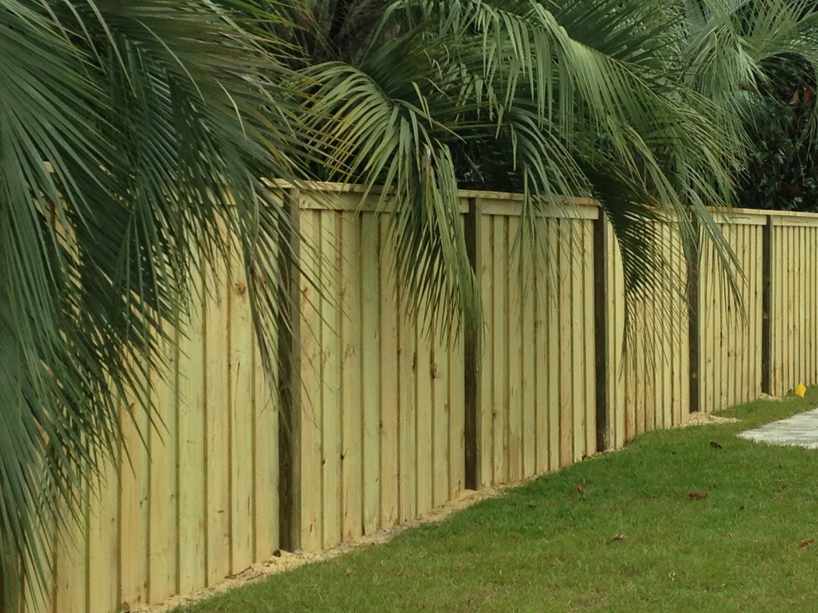 Traditional closed shadow box fence, but with a top rail and trim. 