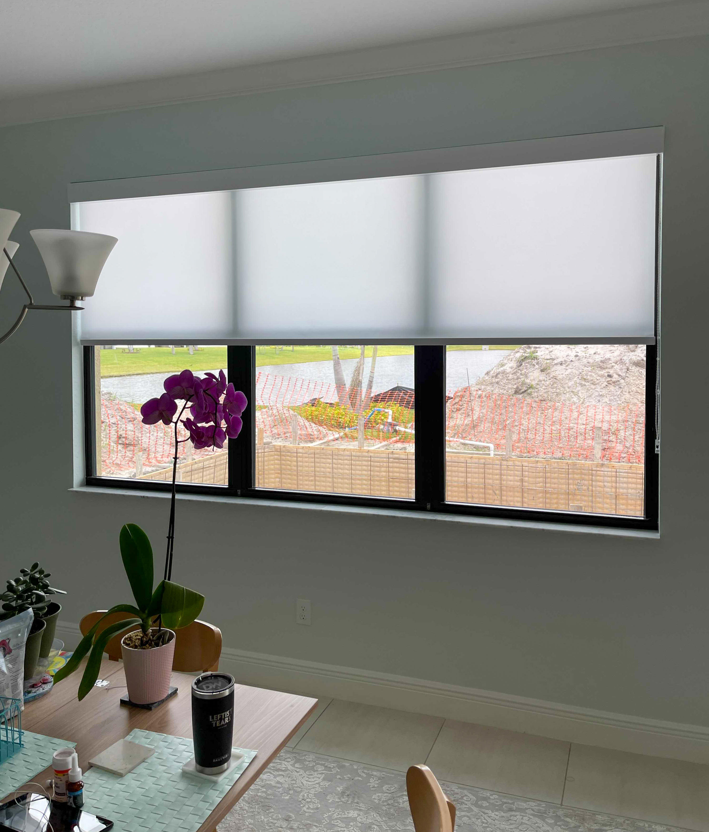 These shades foster heat reduction while still letting in natural light to this Rockledge dining area.