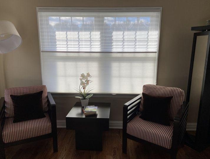 Need flexibility? Check out the cozy little reading nook in this Phillipsburg home! These are our Trilight Shades, which let you adjust them any way you like to filter light!