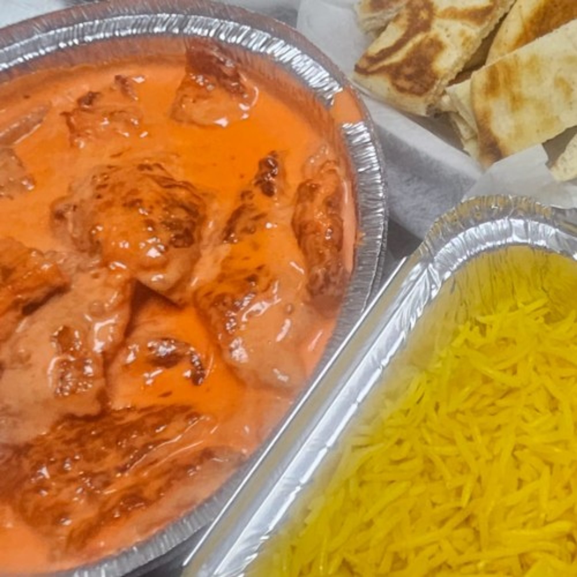 Butter Chicken with Seasoned Yellow Rice & Pita