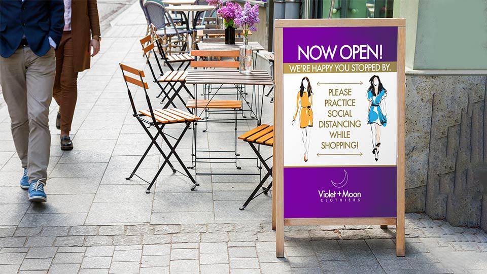 Strong metal signs printed in full color for a women's clothing store that says "Now Open"