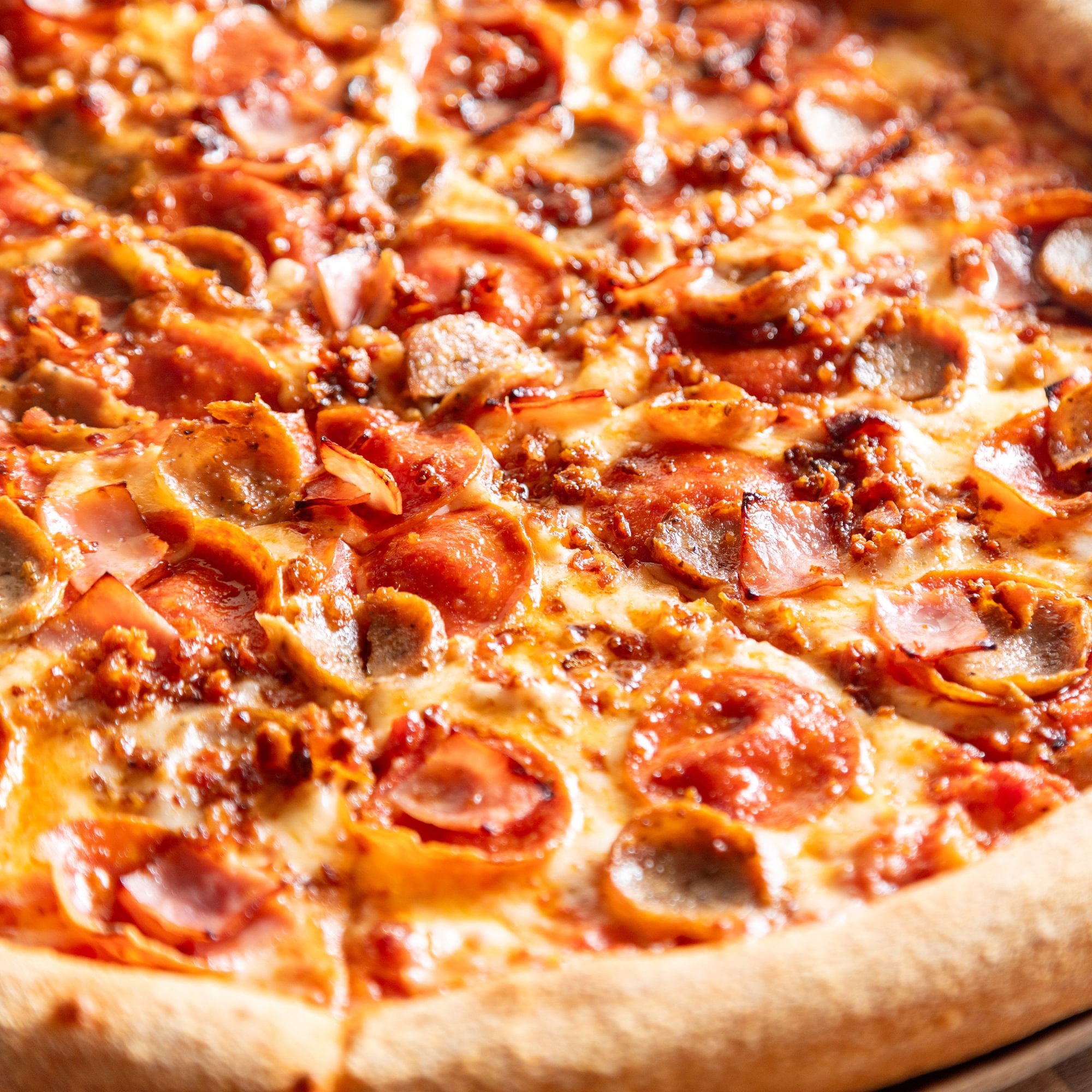 Meat lovers pizza slice