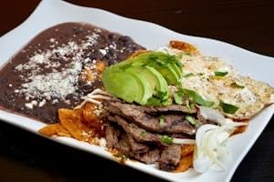 Red Chilaquiles with Grilled Steak, Eggs, & Beans