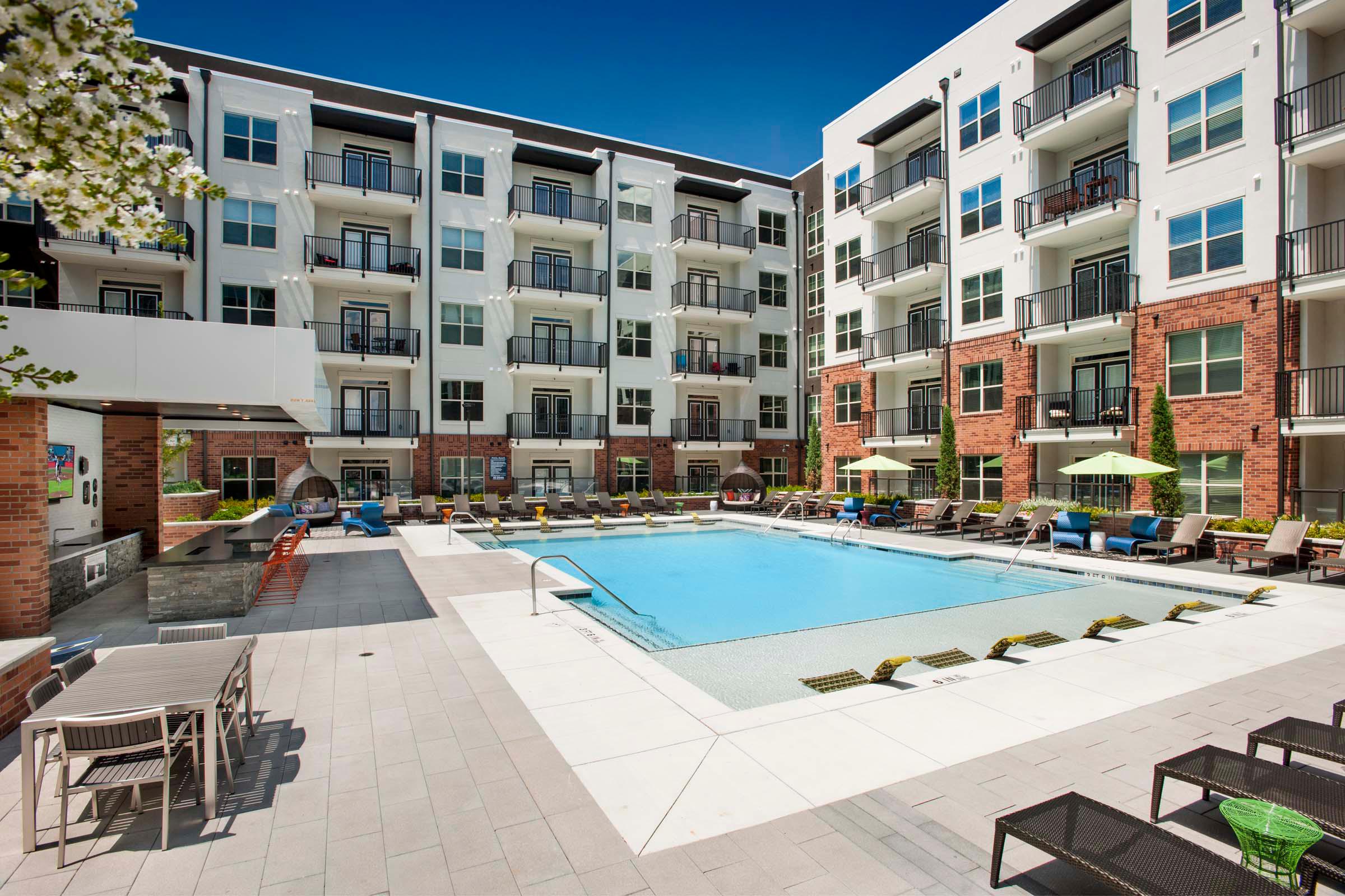 Salt water pool with tanning ledge and lounge seating
