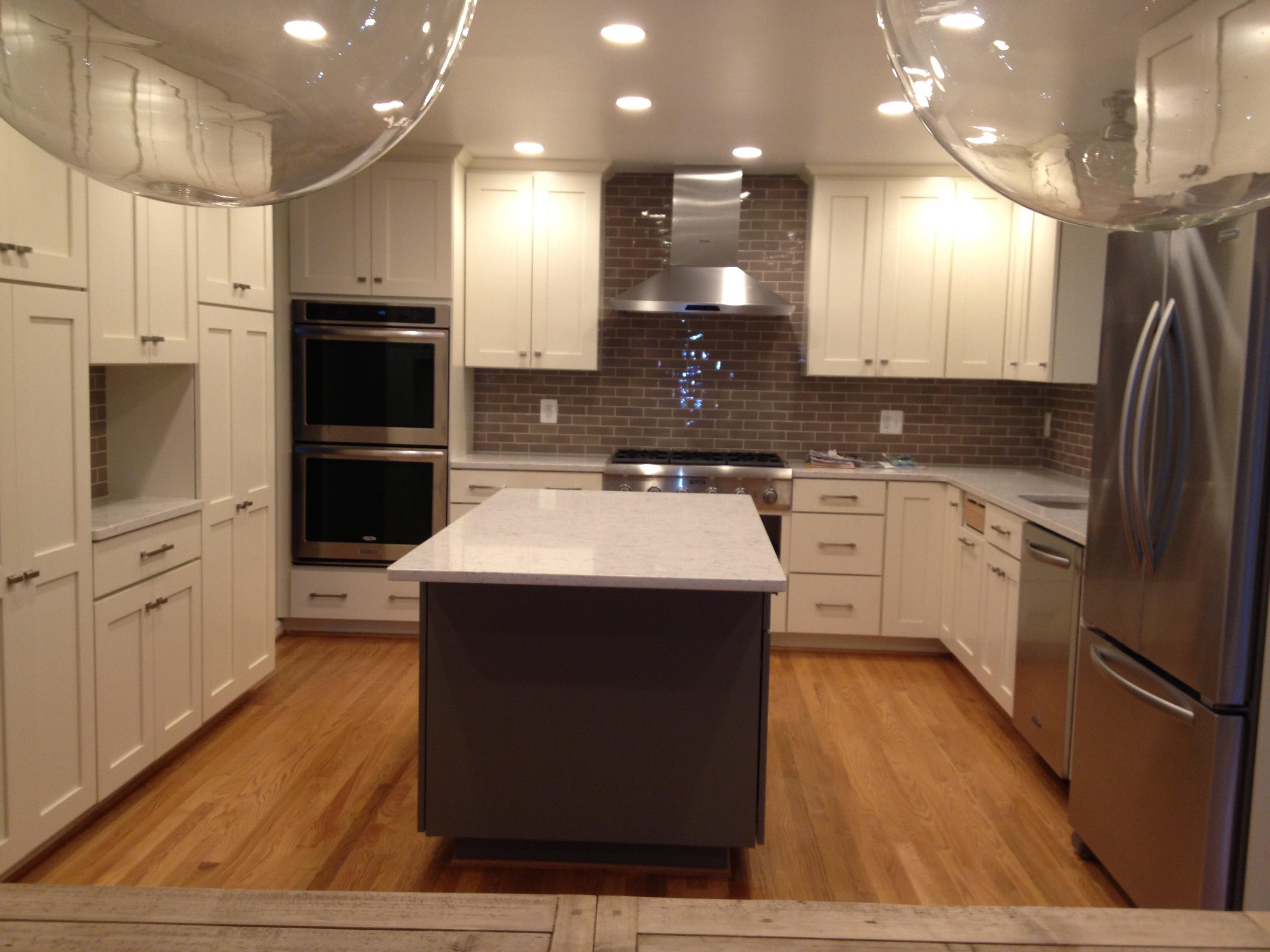 Wall removed, new appliance locations, weaver in oak hardwoods, custom cabinets