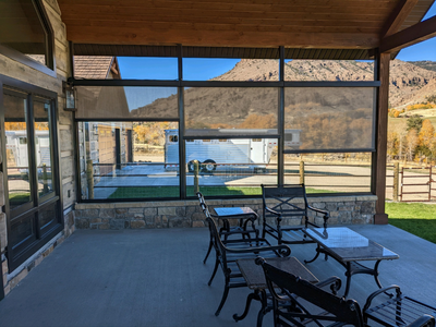 Budget Blinds of Rock Springs can help you cut down on the glare on your patio with exterior roller shades.