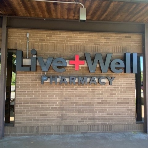 The sign outside Live Well Pharmacy