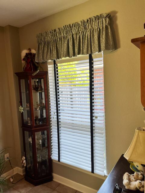 Looking for a great way to give your Wood Blinds a finished look? Try our Valances! You can see them here in this Pensacola home, where they really dress up these Wood Blinds with Decorative Tape!