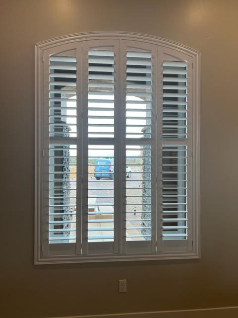 We recently installed this arched Shutter in a Green Valley residence.  This large window is in the living room near the entry way and provides a grand view on the front walkway.  Notice our van out front!