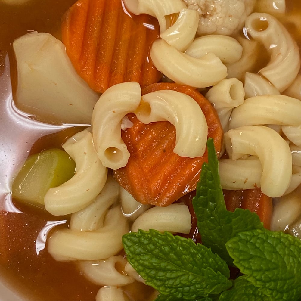 Vegetable Soup (Cooked with Macaroni, Carrots, and Fresh Herbs.) Bread on Side