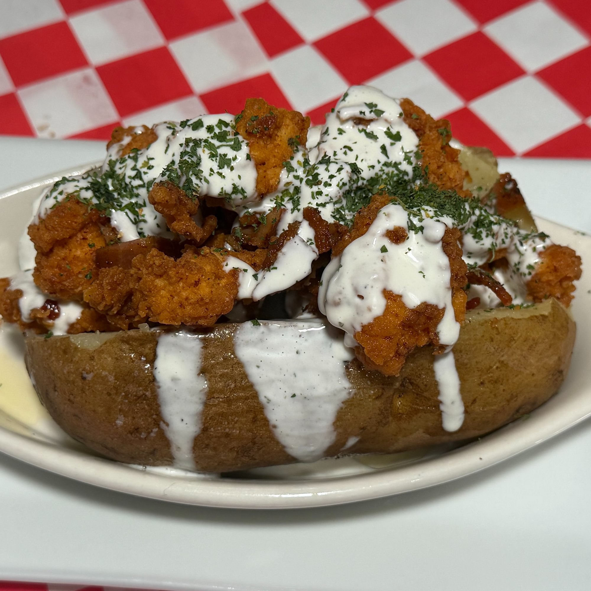Bacon, Popcorn Chicken, & Ranch Stuffed Potato