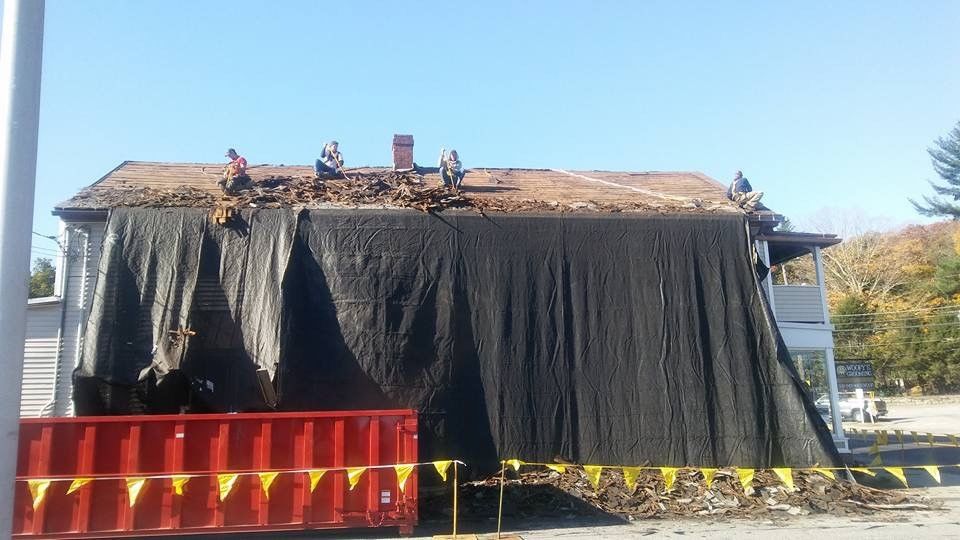 Rudnicki Roofing Inc. Logo