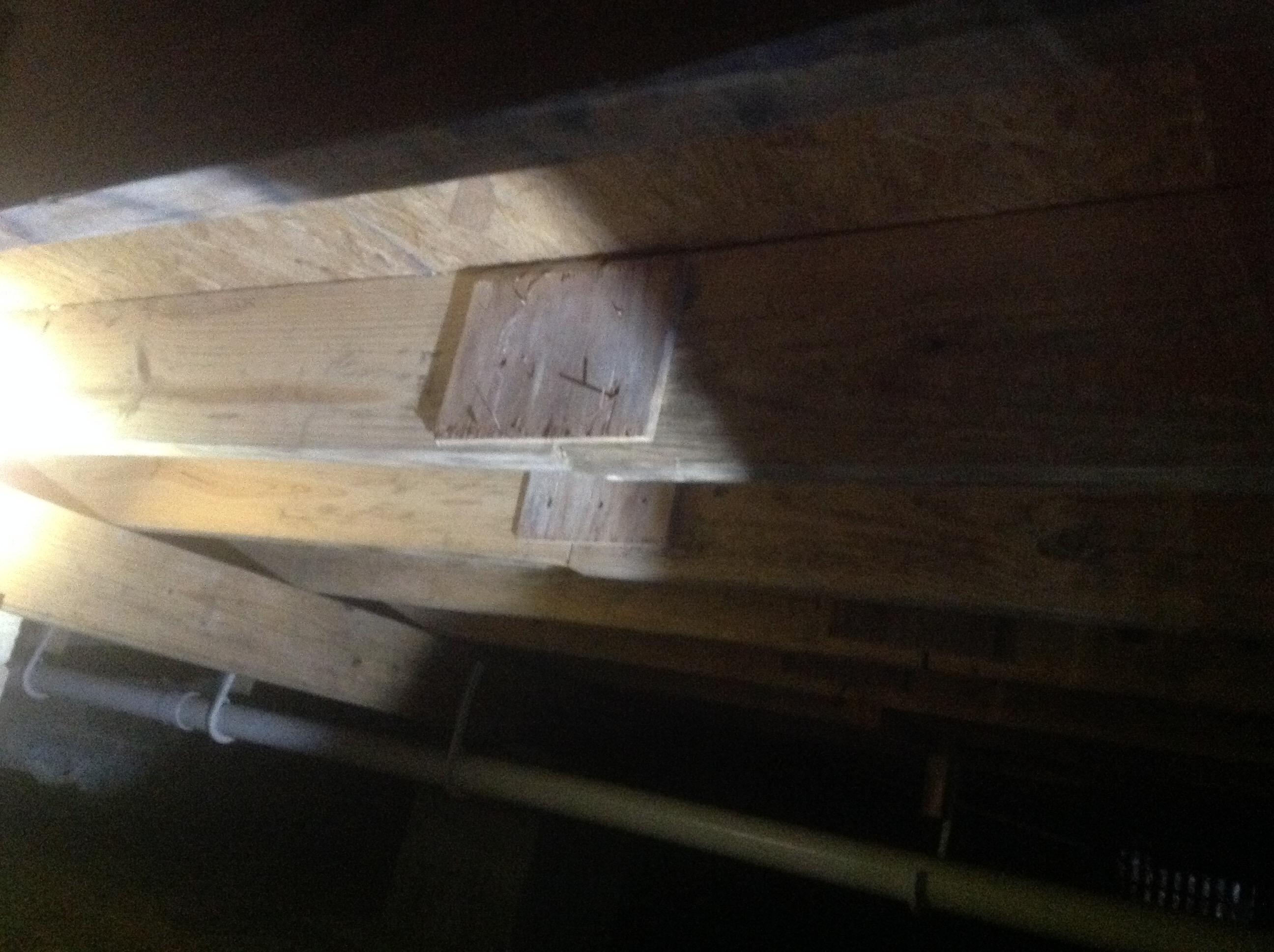 These floor joists were butted together with no support structure and tied together with plywood. And the joists were under sized. This is a sub standard building practice and is a safety hazard. Found by Bumgardner Inspection Services in Miamisburg Ohio.