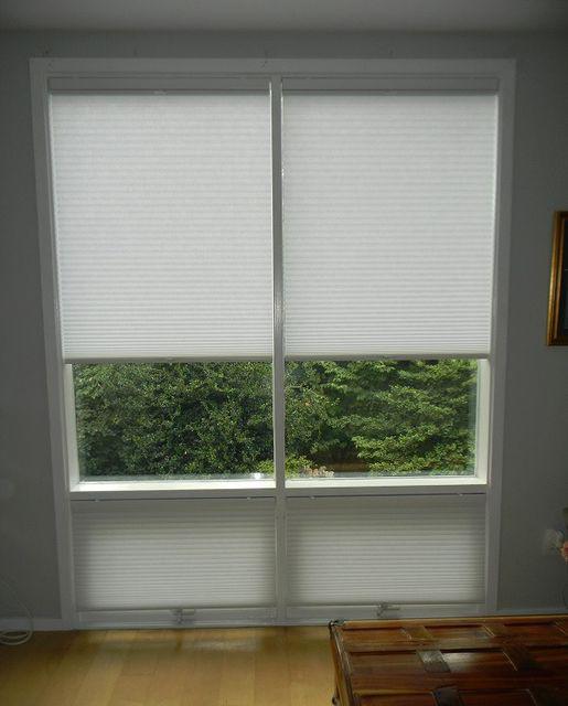 We split these Cellular Shades into four sections to accommodate the operational windows at the bottom. Their flexibility allows the homeowner in Arlington, VA, to precisely control where and how much light comes into the room.  BudgetBlindsArlingtonAlexandria  CellularShades  ShadesOfBeauty  FreeCo