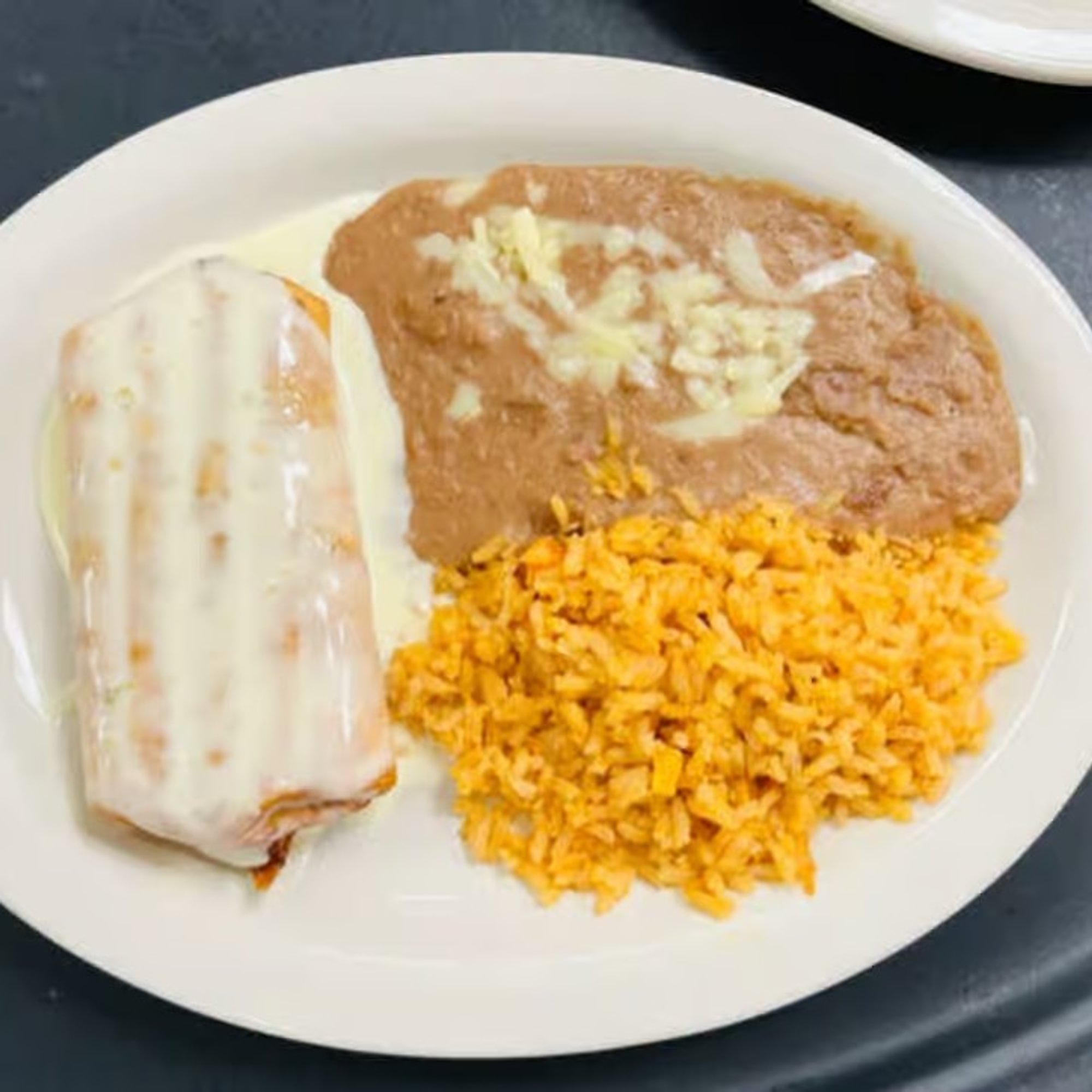 16 Beef or Chicken Chimichanga, Rice and Beans