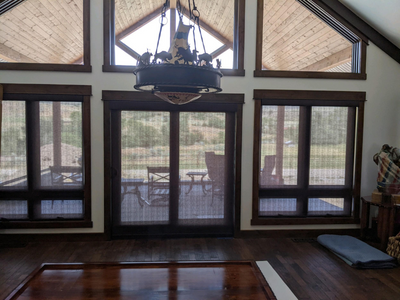 Natural weave roller shades are a great pick for a Wyoming home. Budget Blinds of Rock Springs is here to help you find the perfect fit.
