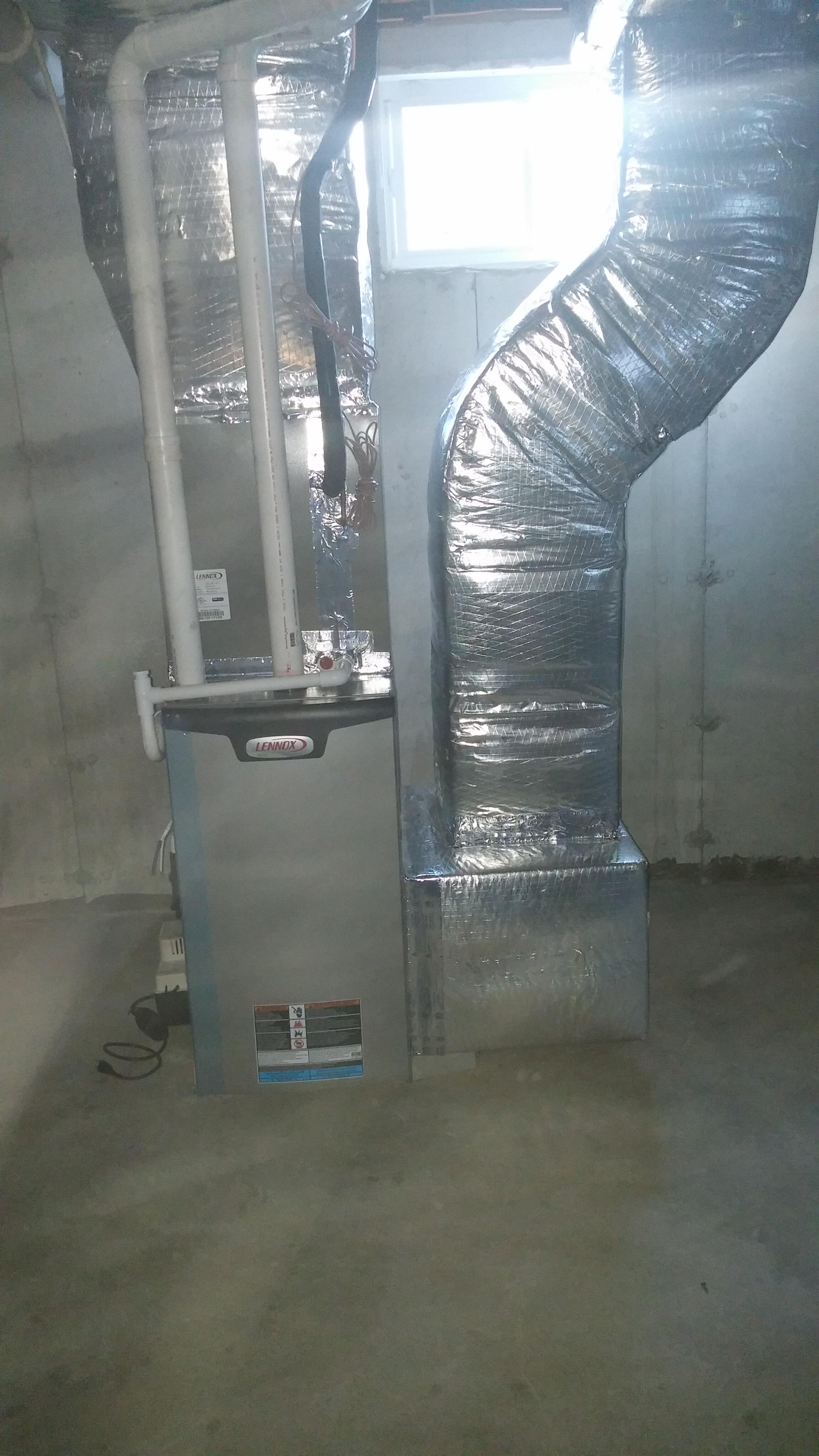 New construction energy star gas fired furnace with air conditioning cooling coil.