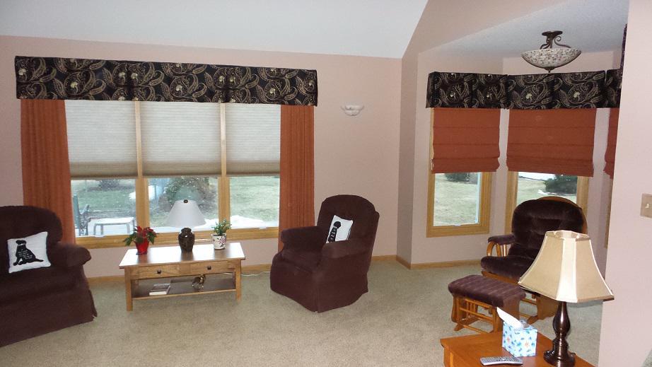 In this Toledo home, we wanted to bring in a pop of color! The solution? We started with gorgeous russet Draperies and added Roman Shades in a matching color-then topped it off with Cellular Shades for Privacy and Valances to complete the look!  BudgetBlindsGreaterToledo  CustomDraperies  CustomVala