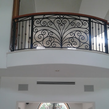 ornamental entrance door and balcony railing
