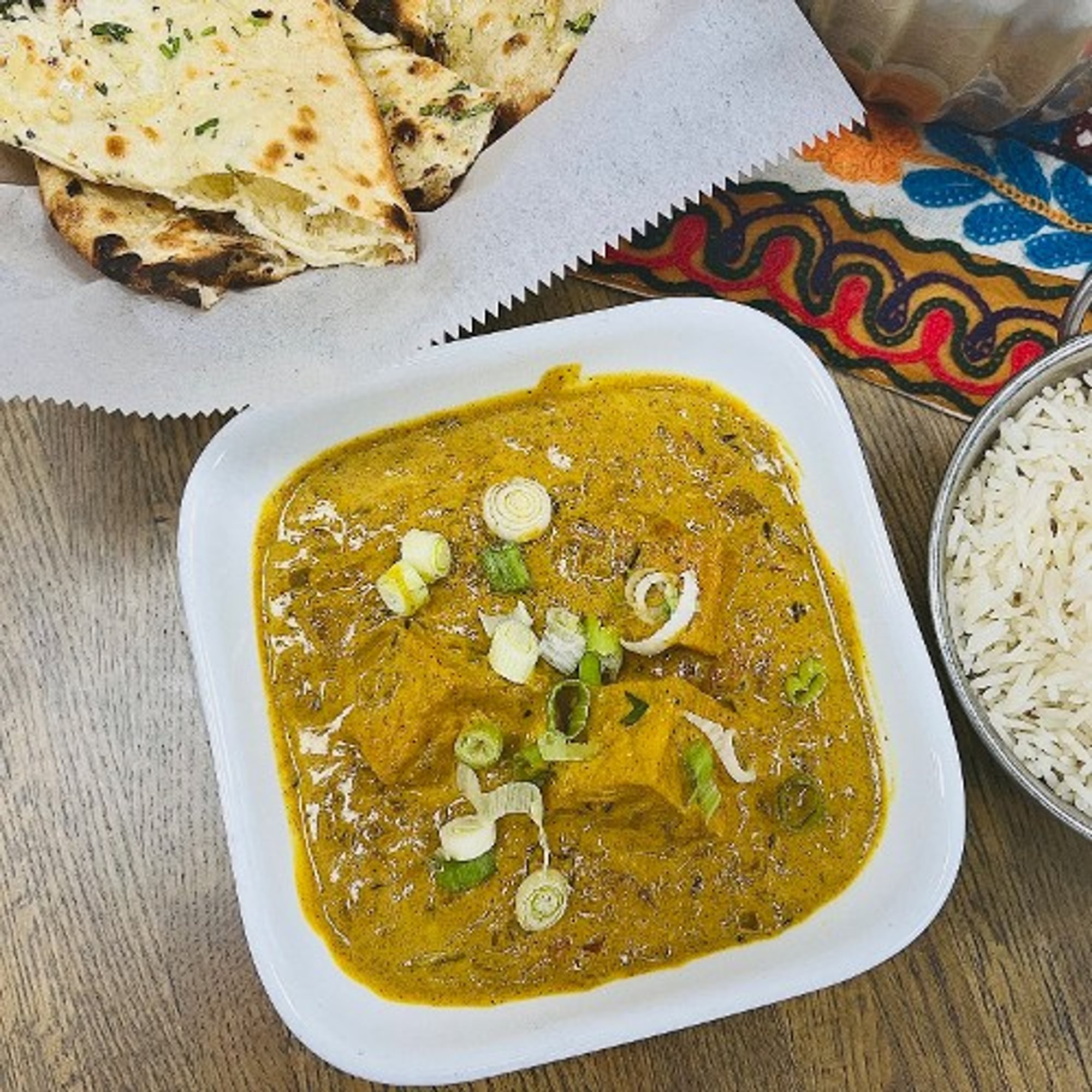 Tofu Curry Served with Rice and Garlic naan