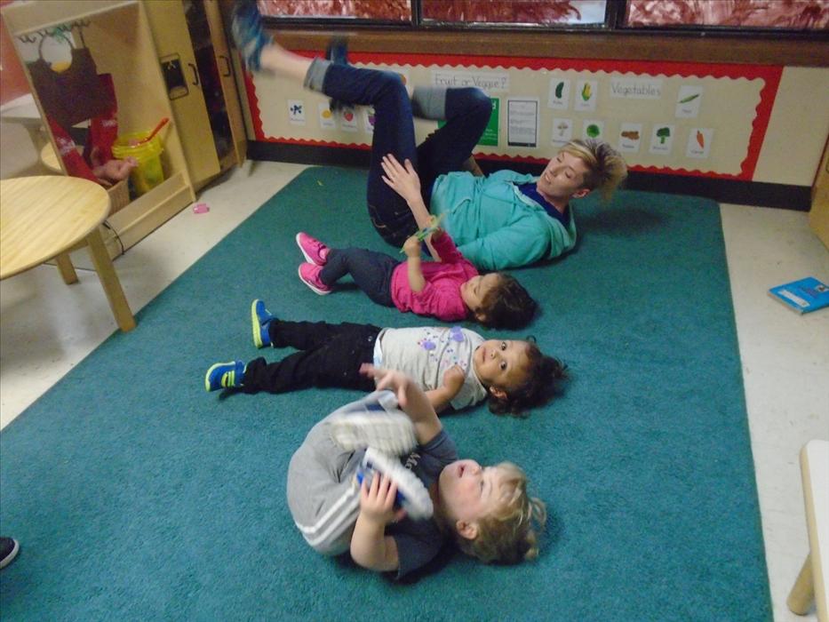 Ms. Crystal is determined to help these toddlers feel calm with some yoga. Yoga is a great way to build the children's physical development while having fun.