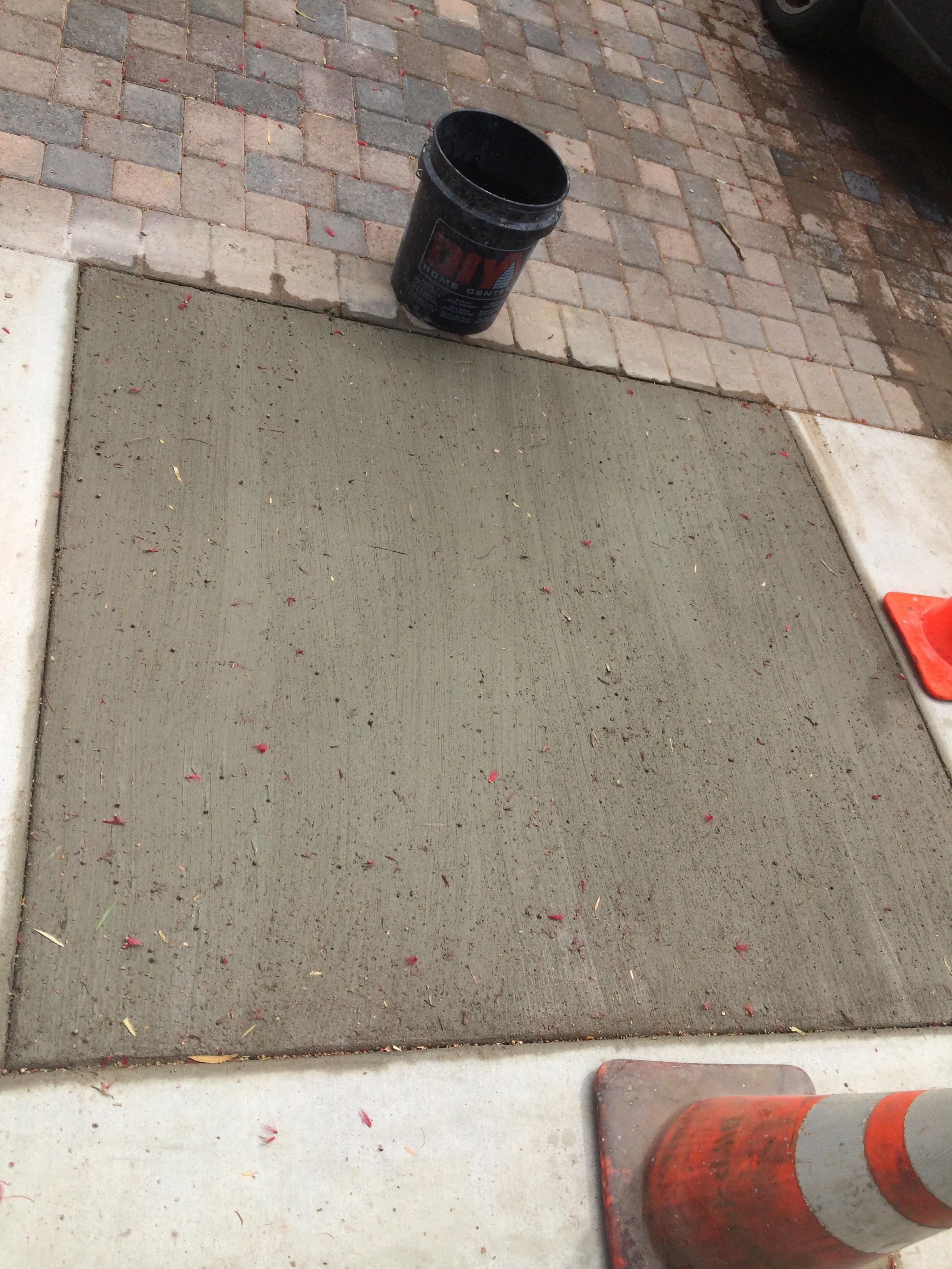 Spot repair on side walk on residential home.Broom finish on concrete