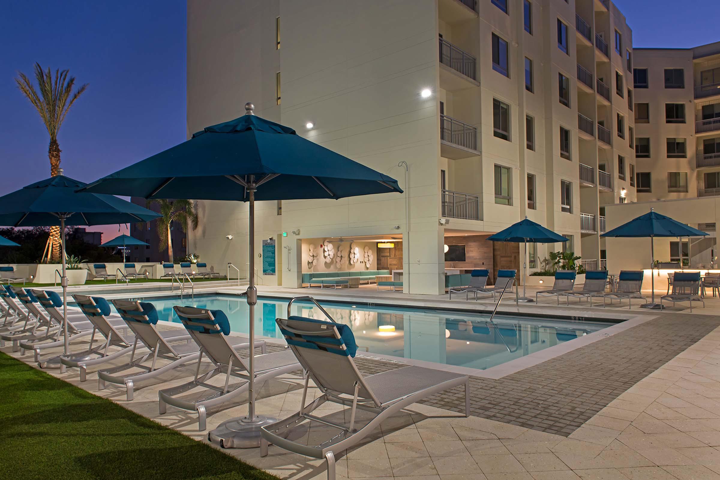 Pool with deck chairs and umbrellas