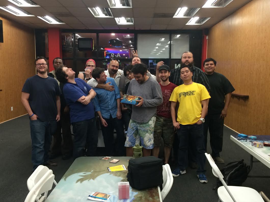 A bunch of people gathered around a Modern Masters booster box. There was a goyf in there!