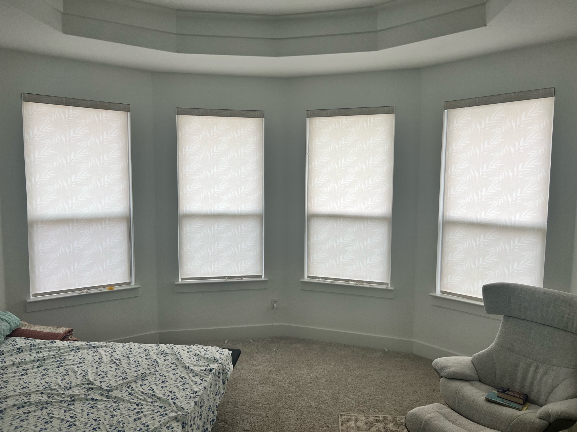 Light filtering patterned roller shade for master bedroom in Leander