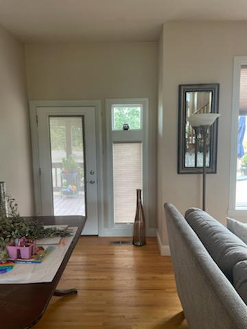 Cellular Shades bring in ample light into the room while giving you privacy. These windows by the door in Mooresville, Indiana, look stunning thanks in part to our Cellular Shades, making them a perfect addition to this well-decorated room.  BudgetBlindsPlainfield  MooresvilleIN  CellularShades  Fre