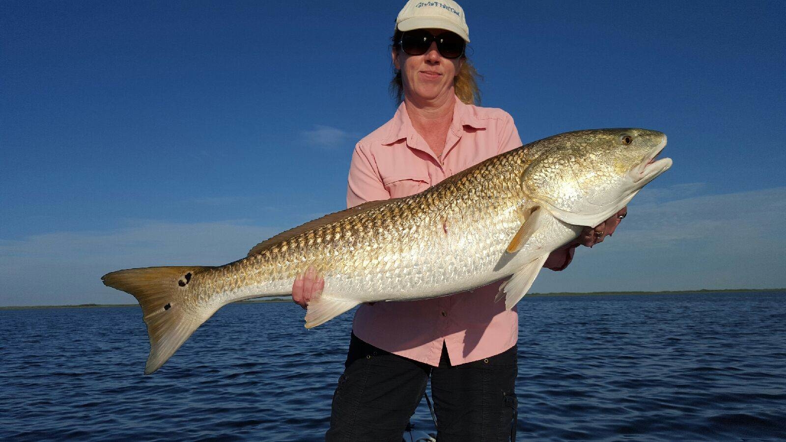 Giant Redfish!! Caught on Fish On Guide Service! your  1 private Fishing Guide, Fishing Charter and Fishing Tours provider located in Corpus Christi, Texas.