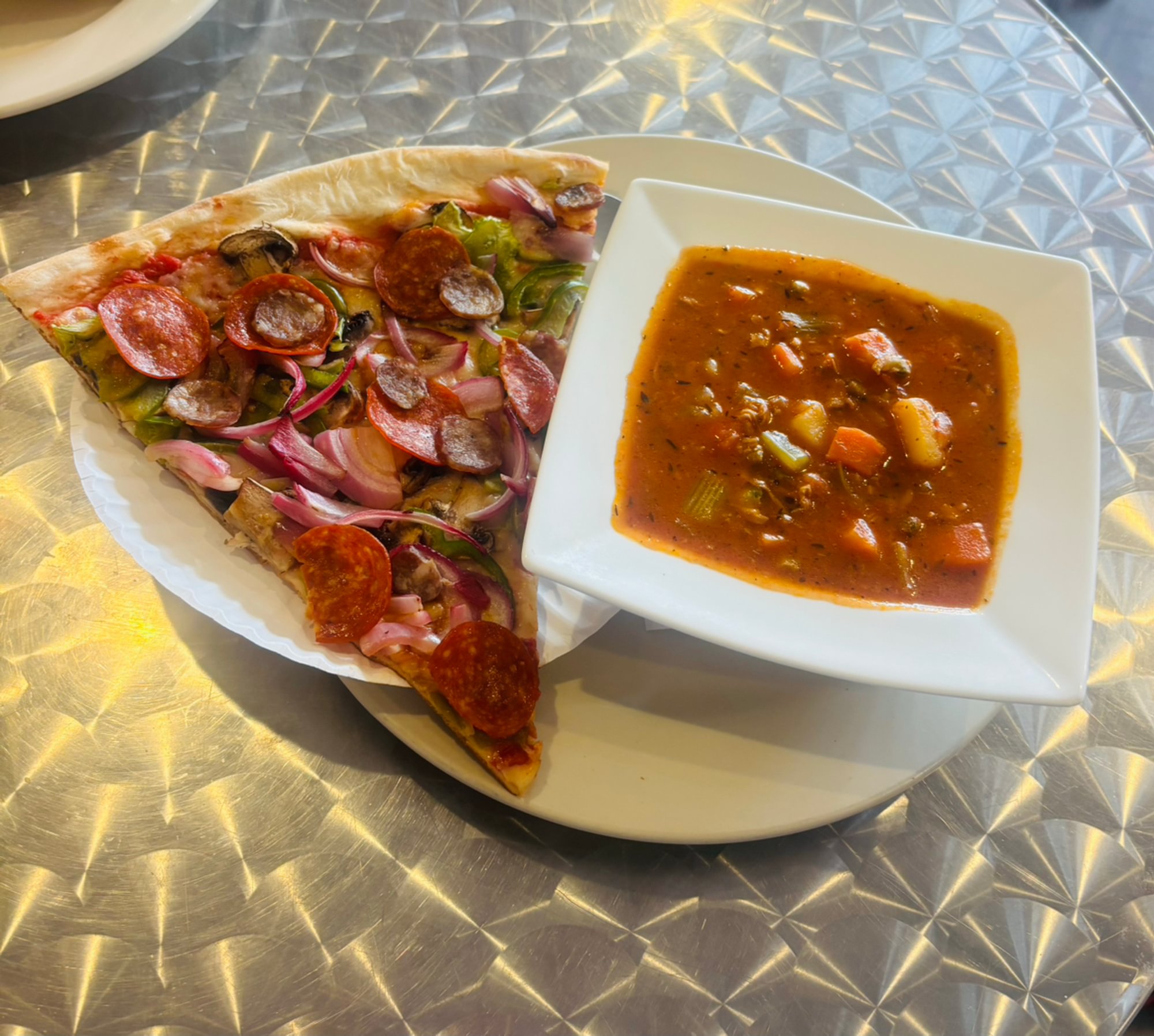 5. Manhattan clam chowder with a slice