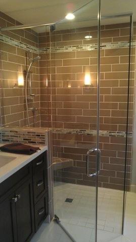 Phoenix kitchen and bath started this shower from open studs to a final fully functioning shower with a built in seat and shelf.