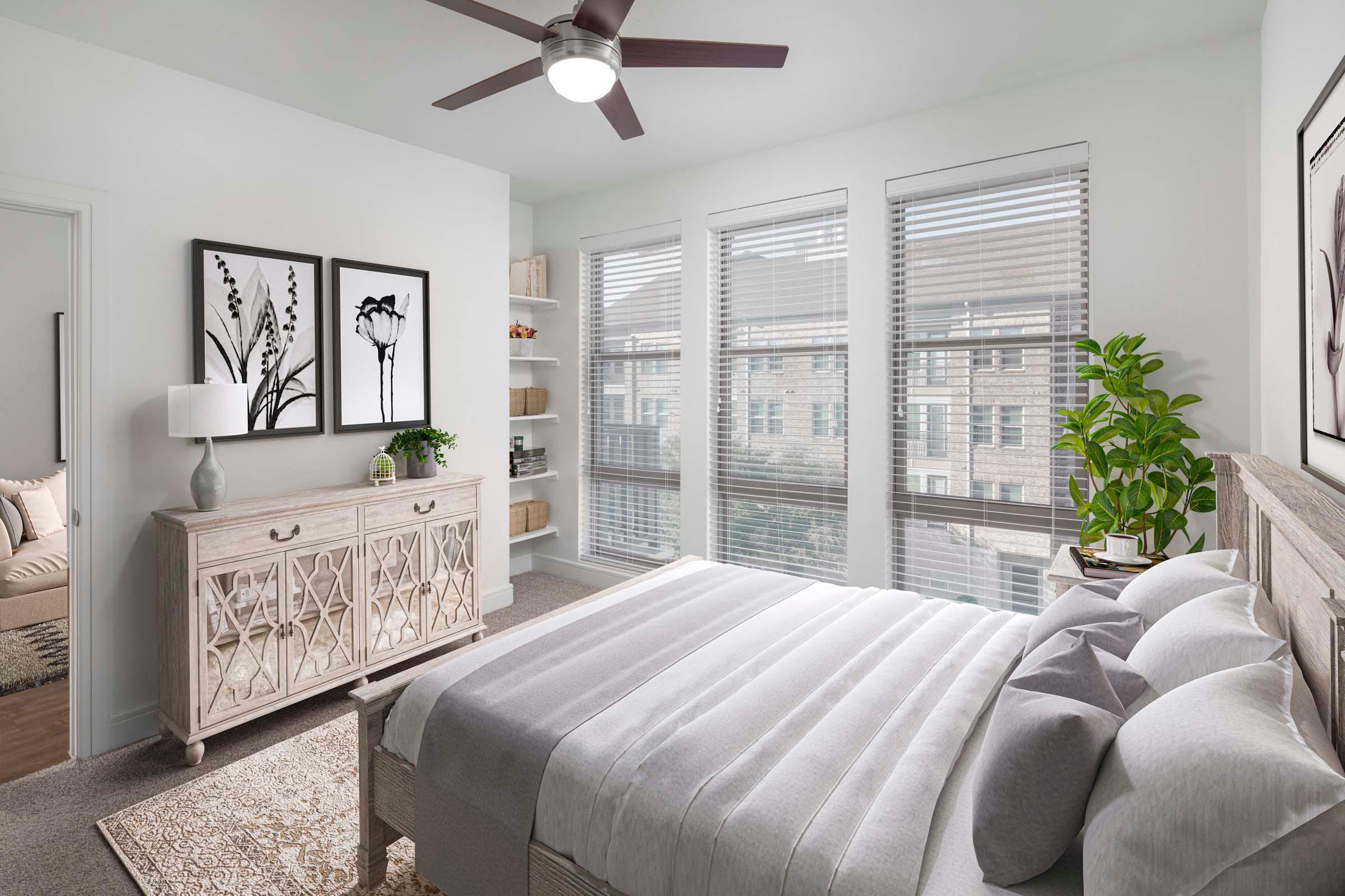 Flats bedroom with carpet and built-in shelves at Camden Greenville