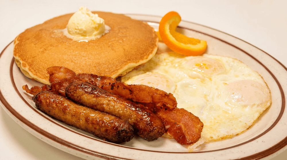 3 Big Hot Cakes, 4 Bacon or Sausage & 3 Eggs