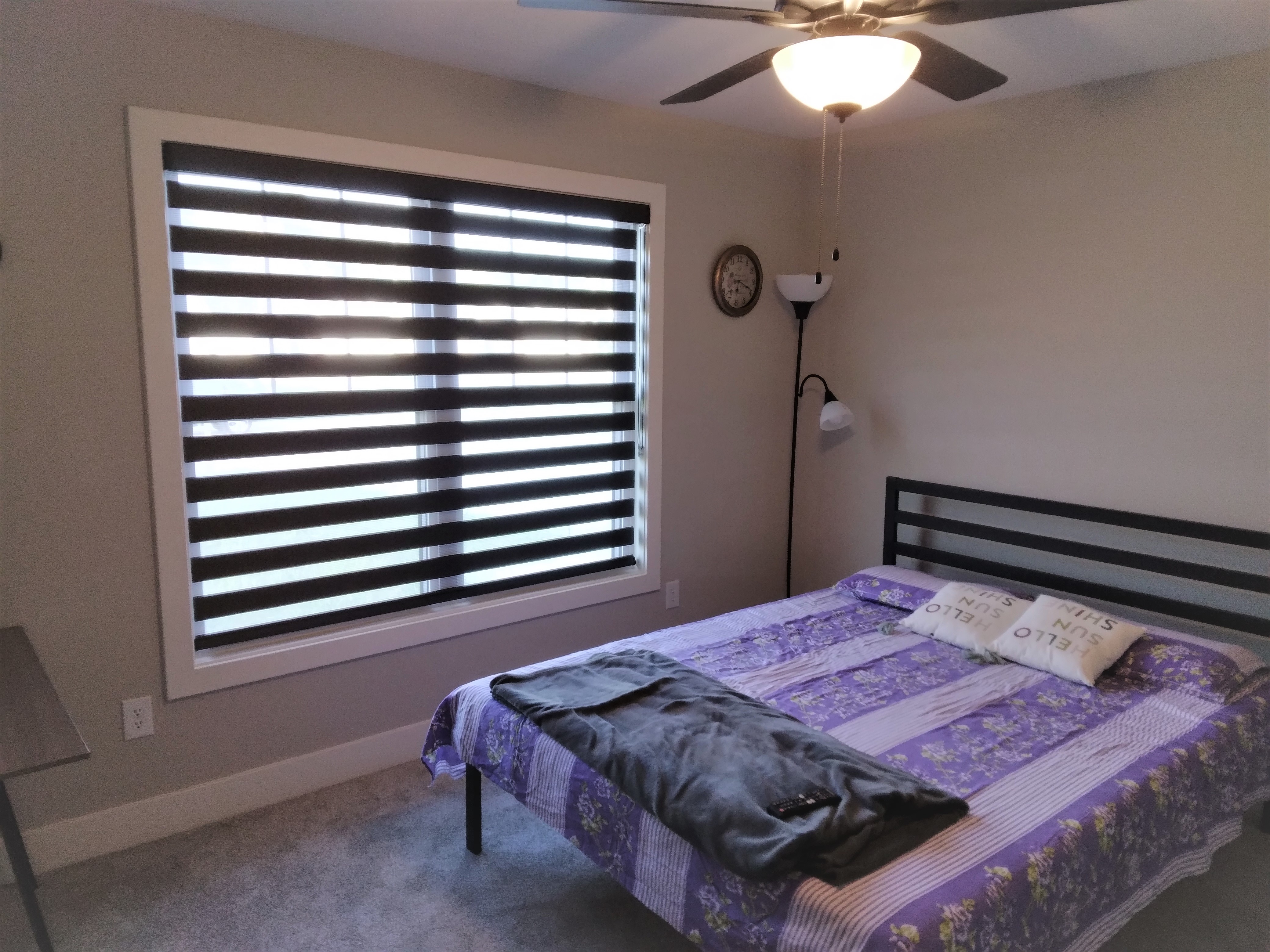 Black dual sheer shades in Springfield Illinois bedroom.  BudgetBlinds  WindowCoverings  DualSheerShades  SpringfieldIllinois