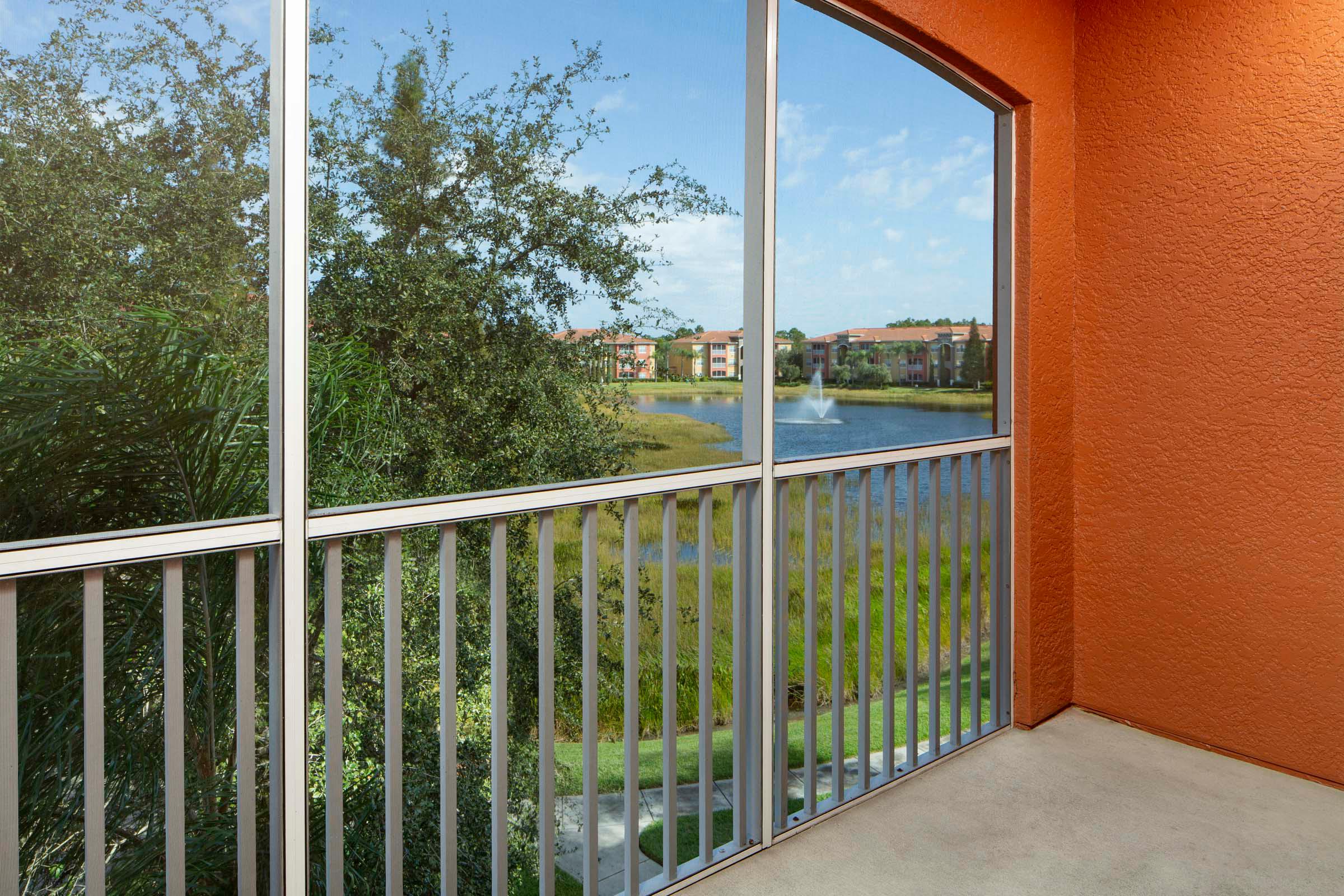 Balcony overlooking lake with water feature