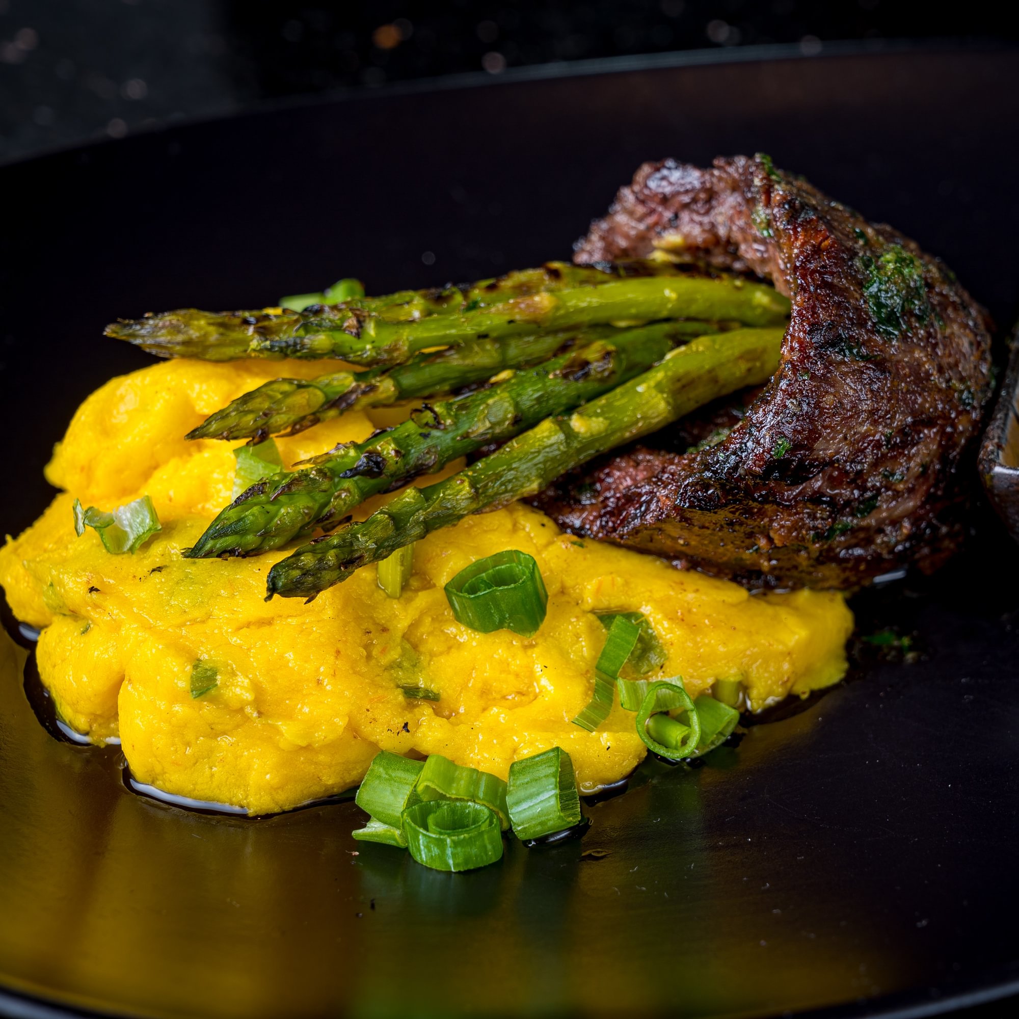 Skirt Steak Over Grilled Asparagus