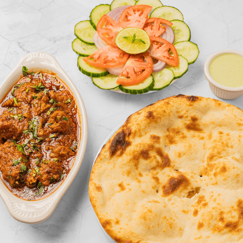 Goat Kadai (Half Pound) +2 Plain Naan + Can of Soda +Salad +Green Sauce